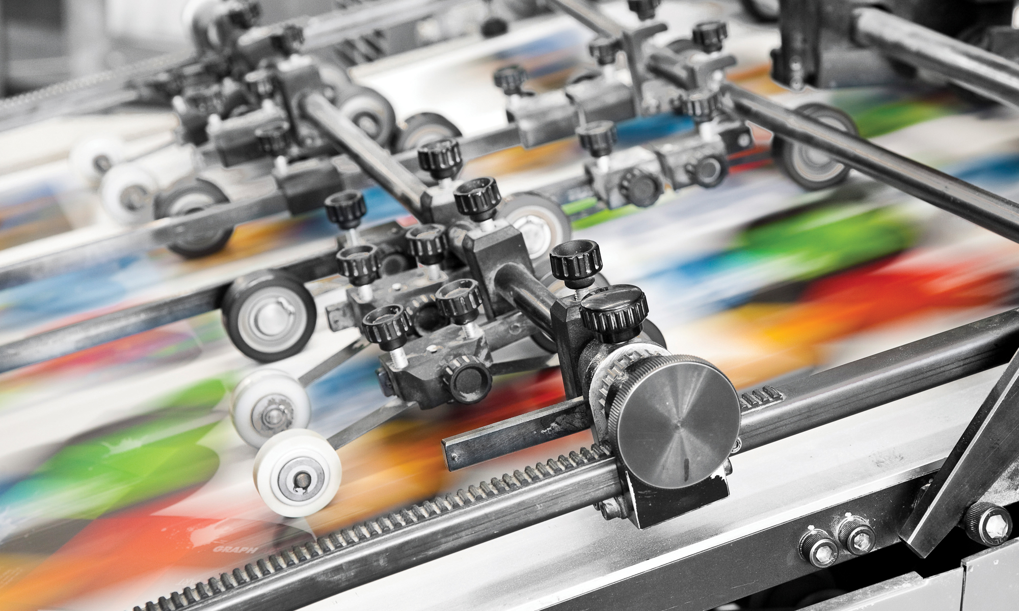 Offset press running a colour job